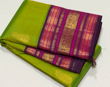 Vaibhogam- Mesmerising Parrot Green with Deep Magenta Handwoven Pure Jari Korvai Buttas Woven Kanjivaram Silk with beautiful varisaipet borders gorgeous pallu and contrast woven blouse