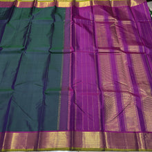Nayaki- Gorgeous Deep Sapphire Green  with Dark Magenta  Handwoven Pure Kanjivaram Silk with beautiful bawanchi borders with green selvedges with rich pallu and contrast woven blouse