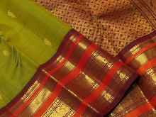 Vaibhogam- Gorgeous Olive Green with Deep Maroonish Brown Handwoven Pure Jari Korvai Kanjivaram Silk with beautiful Varisaipet borders rich pallu and contrast woven blouse