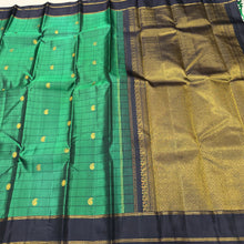 Sahana- Gorgeous Emerald Green with Black Handwoven Pure Jari Checked Kanjivaram Silk with paisleys woven checks with beautiful rettapet bodi borders gorgeous pallu and contrast woven black blouse
