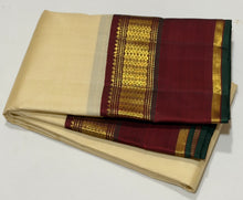 Sarasangi- Gorgeous Creamish White with Deep Brown Handwoven Pure Jari Korvai Kanjivaram Silk with beautiful borders green selvedges rich pallu and contrast woven blouse