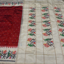 Arabhi- Stunning Rust with Creamish Offwhite Handwoven Premium Zariless Double Ikat with beautiful body with rich Ikat style woven borders pallu and contrast offwhite blouse