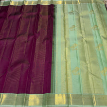 Vaibhogam- Mesmerizing Deep wine with pastel green Handwoven Pure 2g Jari Korvai Vairaoosi body with beautiful yazhis and annapakshis woven borders rich yazhi buttas woven beautiful pallu and contrast woven blouse