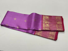 Lilac with Onion Pink Handwoven Pure Jari Kanjivaram Silk Saree with Silver Mayil Chakram motifs in body and rich borders in golden jari with beautiful pallu and contrast woven blouse