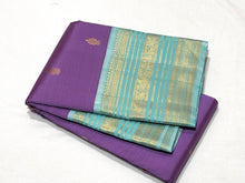 Vaibhogam- Gorgeous Medium Lavendar with Turquoise Blue Handwoven Pure Jari Korvai Buttas Woven Kanjivaram with Rich Varisaipet Borders Beautiful Pallu and Contrast Woven Blouse