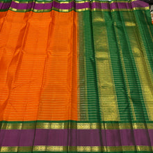 Vaibhogam- Gorgeous Orange with Emerald Green Handwoven Pure Jari Korvai Kanjivaram Silk with beautiful jari veldhari stripes and silk thread striped body with beautiful doublepet borders with rich pallu and contrast woven blouse