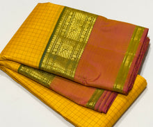 Sahana- Gorgeous Sunshine Yellow with Muthukattam Handwoven Beautiful Pure Jari Kanjivaram Silk with beautiful peachish pink with Olive Green spaced borders rich olive green pallu and contrast woven blouse
