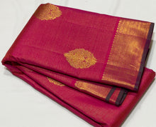 Vaibhogam- Gorgeous Dual tone Burnt Orange Pink with Green Vairaoosi with Buttas Handwoven Pure Jari Kanjivaram Silk with beautiful double Peacock motifs woven body with rich borders with green selvedges beautiful pallu contrast woven green blouse