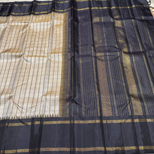 Khakhi Beige with Kanchana Black Handwoven Pure Jari Korvai Checked Kanchipuram Silk Saree with Rettapet borders Seer Pallu and contrast woven blouse beauty