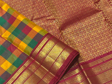 Gorgeous Palum Pazhamum Checks in a beautiful Korvai Handwoven Pure Jari Kanjivaram Silk Saree with very intricately woven vanki borders and inbetween mayilkan motifs woven with rich and finely woven pallu in arakku with laksham buttas and contrast blouse