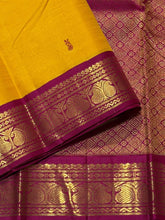 Vaibhogam- Gorgeous Mustard with Magenta and Bottle Green Handwoven Pure Jari Korvai Kanjivaram Silk with thread buttas woven body with beautiful ganga jamuna borders rich pallu and contrast woven blouse