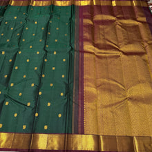 Sahana- Gorgeous Bottle Green with Deep Maroon Mayil Chakram Buttas Handwoven Pure Jari Kanjivaram Silk with beautiful bawanchi borders rich pallu and contrast woven blouse