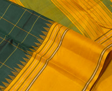 Saraswati- Gorgeous Bottle Green with Ganga Jamuna Temple Borders with Checked body Handwoven Pure Premium Zariless Korvai Kanjivaram Silk with beautiful body rich seer pallu and contrast woven blouse