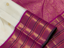 Vaibhogam- Stunning Offwhite with Fuchsia Pink Handwoven Pure Jari Korvai Kanjivaram Silk with beautiful buttas woven body with rich varisaipet borders beautiful pallu and contrast woven blouse with bottle green selvedges