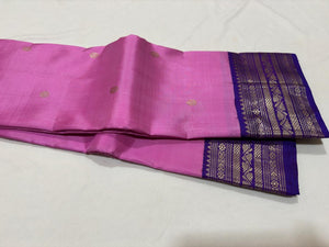 Medium tone Lotus Pink with Violetish Purple Handwoven Pure Silver and Gold twisted Jari Korvai with Buttas Kanjivaram Silk Saree Beauty