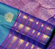 Vaibhogam- Gorgeous Peacock Bluish Green with Purple Handwoven Pure Jari Kanjivaram Silk in Vairaoosi with Buttas woven beautiful body with varisaipet borders rich pallu and contrast purple vairaoosi blouse