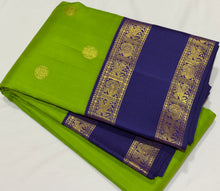 Vaibhogam- Gorgeous Bright Green with Deep Blue Handwoven Pure 2g Jari Korvai Kanjivaram Silk with beautiful chakram and gandaberunda motifs woven body with beautiful silk threads and jari woven doublepet borders gorgeous pallu and contrast woven blouse