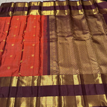 Vintage Beauty in a Rich Rust and Dark Brown Combination with Vairaoosi Jari Kattam with Mayil Chakram Buttas Doublepet borders rich pallu and contrast woven blouse