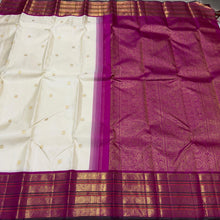 Vaibhogam- Stunning Offwhite with Fuchsia Pink Handwoven Pure Jari Korvai Kanjivaram Silk with beautiful buttas woven body with rich varisaipet borders beautiful pallu and contrast woven blouse with bottle green selvedges