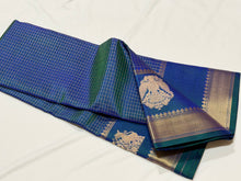 Sahana- Beautiful Peacock Blue with Gold and Green selvedges Handwoven Pure Jari Kanjivaram Silk with beautiful yazhis and gandaberunds woven both side borders kottadi jari checks woven body rich pallu and self colored blouse