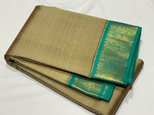 Beautiful Beige with Turquoise Green Handwoven Pure Jari Korvai Kanjivaram Silk with beautiful Yazhis and Annapakshis woven borders rich pallu and contrast woven blouse