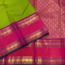 Vaibhogam -Gorgeous Parrot Green with Pink Vairaoosi Handwoven Pure Korvai Kanjivaram Silk with doublepet borders in pink and orange shades with rich pallu and contrast Vairaoosi woven beautiful blouse