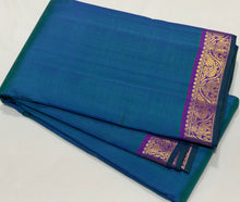 Nayaki- Peacock Blue Green with Purple Handwoven Pure Kanjivaram Silk with small borders rich seer pallu and contrast woven blouse