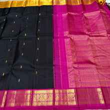 Vaibhogam-Gorgeous Black with Mustard and Rani Pink Ganga Jamuna borders Handwoven Pure Jari Korvai Kanjivaram Silk with Buttas woven beautiful body rich borders pallu and contrast blouse. A stunner for this wedding season !