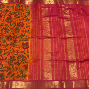 Bright Orange with dual tone Orange Handwoven Pure Kanjivaram Semicontrast Silkcotton Saree with Hand Pichwai Block Printed Beauty