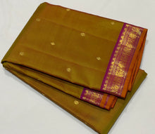 Sahana- Gorgeous Golden Double tone Sampanga mustard shot green tint with Purplish Pink Buttas Handwoven Pure Jari Kanjivaram Silk with Small intricate borders with orange selvedges rich pallu and contrast woven blouse