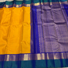 Vaibhogam-Gorgeous Golden Mustard with Peacock Blue and Violetish Blue Buttas Handwoven Pure Jari Korvai Kanjivaram Silk with Spaced borders rich pallu and contrast woven blouse. A very beautiful piece for this wedding season!