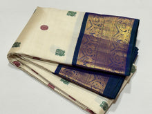 Stunning Handwoven Pure Jari Kai Korvai Kanjivaram Silk Saree in Offwhite body with Sapphire Blue combination with rich pattu buttas woven body gorgeous borders rich pallu and contrast woven blouse