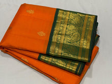 Vaibhogam- Stunning Orange with Bottle Green Handwoven Pure Zari Korvai Kanjivaram Silk with Buttas woven body with rich Borders gorgeous pallu and contrast green blouse