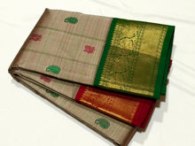 Vaibhogam-Gorgeous Beige Abirami with Ganga Jamuna borders Striped body with silk thread buttas with rich bottle green rich and beautifully wovwn pallu and contrast woven blouse