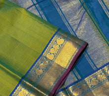 Nayaki- Gorgeous Parrot Green with Peacock Blue tone  Handwoven Pure Kanjivaram Silk with beautiful bawanchi borders with rich pallu and contrast woven blouse