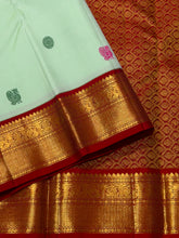 Vaibhogam- Gorgeous Pista Green with Violetish blue and Burgundy Maroon Handwoven Pure 2g Jari Korvai Kanjivaram Silk with Pattu Buttas woven body rich borders ganga Jamuna beautiful pallu and contrast woven blouse