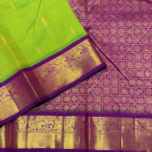 Vaibhogam-Mesmerizing Sneha Green with  purple handwoven pure Jari Korvai Kanjivaram silk with rich borders buttas woven body gorgeous pallu and contrast woven beautiful blouse