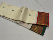 Vaibhogam-Stunning  Offwhite with Ganga Jamuna borders with gorgeous pattu buttas woven body with deep emerald green and burnt orange shade borders beautifully woven rich pallu and contrast woven blouse