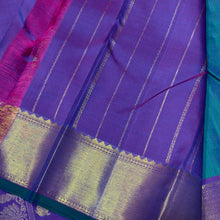Sahana- Stunning Peacock Bluish Green with Purple Handwoven Pure 2g Jari Kanjivaram Silk with Muthukattam and Buttas woven beautiful body with rich bawanchi borders gorgeous kalakshetra kili pallu and contrast purple blouse
