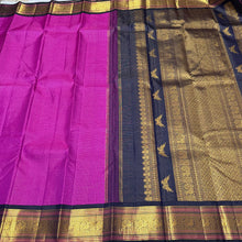 Vaibhogam- Stunning Magenta with dark kanchana blackish Blue Vairaoosi checks Handwoven Pure Jari Korvai Kanjivaram Silk with Rettaikili buttas woven body, beautiful borders rich pallu with bird buttas and contrast Vairaoosi woven blouse