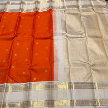 Vaibhogam-Gorgeous Orange with Offwhite Handwoven Pure Jari Korvai with Mayil Chakram Buttas woven body beautiful rettaipet with zari oosi striped borders rich pallu and contrast woven blouse. A stunner for this wedding season!