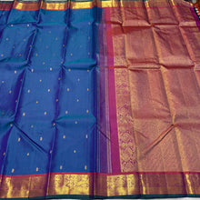Sahana- Stunning Peacock Blue with Rustic Orange Buttas Handwoven Pure Jari Kanjivaram Silk with beautiful borders with green selvedges rich pallu and contrast woven blouse