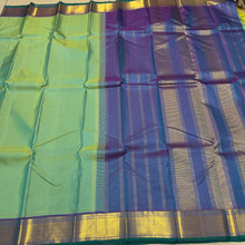 Nayaki- Gorgeous Pastel Green with Double tone Blue Handwoven Pure Kanjivaram Silk with beautiful bawanchi borders with rich pallu and contrast woven blouse