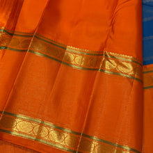 Vaibhogam- Gorgeous Peacock Blue with Orange Handwoven Pure Jari Korvai Kanjivaram Silk with Vairaoosi and Veldhari Striped body with rich doublepet borders with vairaoosi woven middle portions with gorgeous pallu and contrast woven beautiful blouse