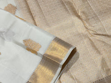 Gorgeous Offwhite with Gold Combination in Handwoven Pure Kanjivaram Silk Saree with rich Peacock driven chariot motifs woven all over the body with beautiful and intricate borders rich woven pallu and blouse with Zari strips