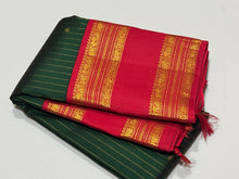 Vaibhogam-Super Gorgeous Bottle Green with Red Handwoven Pure Jari Korvai with oosi vanam lines with Rudraksha buttas woven all over body with Doublepet Rich Borders with rich and finely woven beautiful Pallu and Contrast woven red blouse