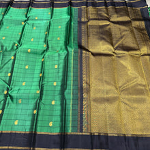 Sahana- Gorgeous Emerald Green with Black Handwoven Pure Jari Checked Kanjivaram Silk with paisleys woven checks with beautiful rettapet bodi borders gorgeous pallu and contrast woven black blouse
