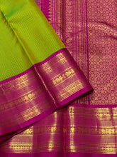 Vaibhogam- Stunning Parrot Green with Rani Pink Vairaoosi Checks Handwoven Pure Jari Korvai Kanjivaram Silk with beautiful rich borders gorgeous pallu and contrast Vairaoosi blouse