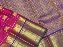 Dual tone Rani Pink with Purple in a rich Handwoven Pure Kanjivaram Silk Saree with Doubleparrots woven in jari checked body beautiful borders pallu and contrast woven blouse