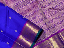 Royal Blue with Purple Buttas Handwoven Pure Jari Kanjivaram Silk Saree with rich buttas woven body , intricate mayil chakram buttas woven borders, gorgeous pallu and contrast woven blouse